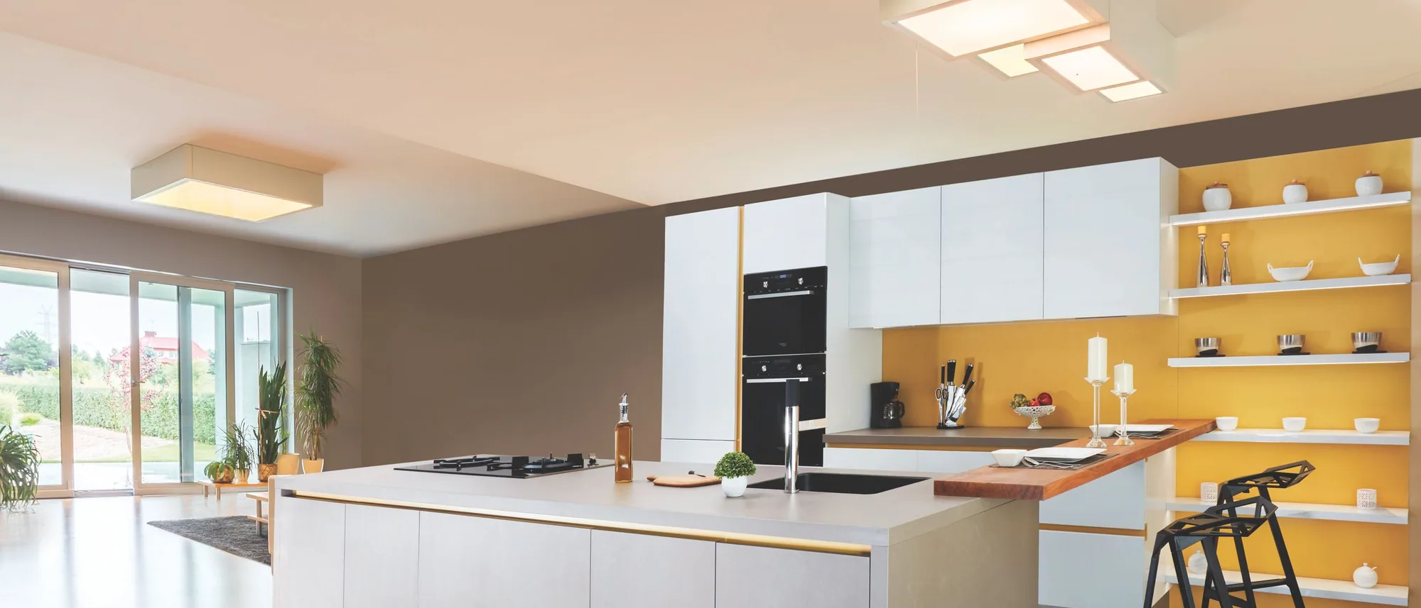 Modern Enigma kitchen in dark tones with illuminated island
