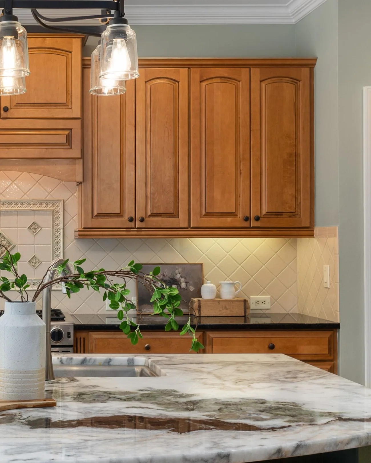 Vintage Splendor kitchen with marble island and pendant lighting