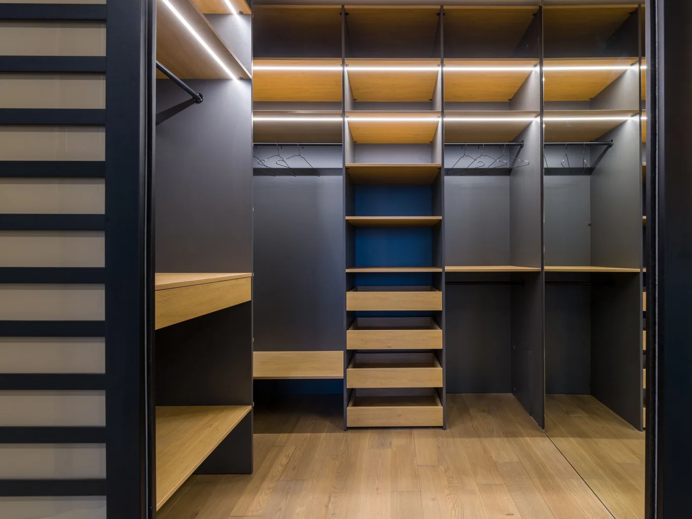 Walk-in wardrobe with LED-lit shelving