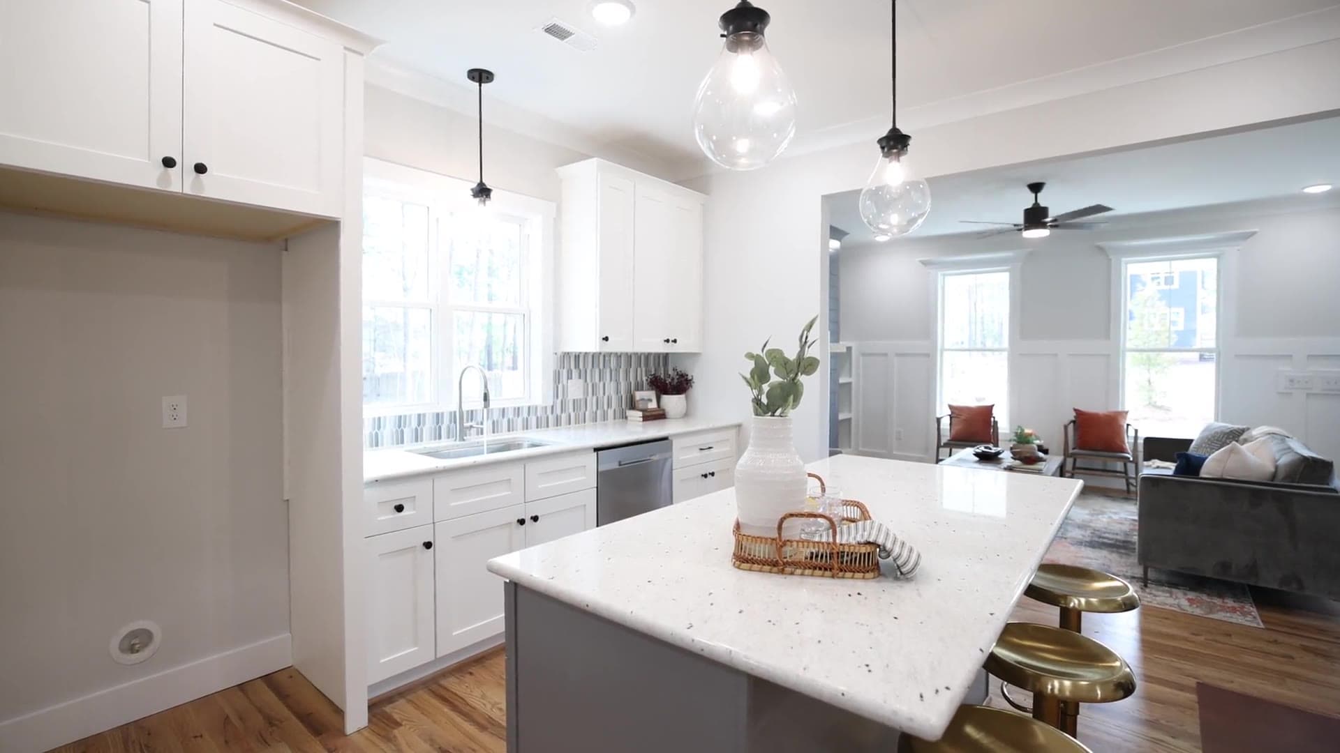 Bright modern Apro Living kitchen with a spacious island and elegant lighting