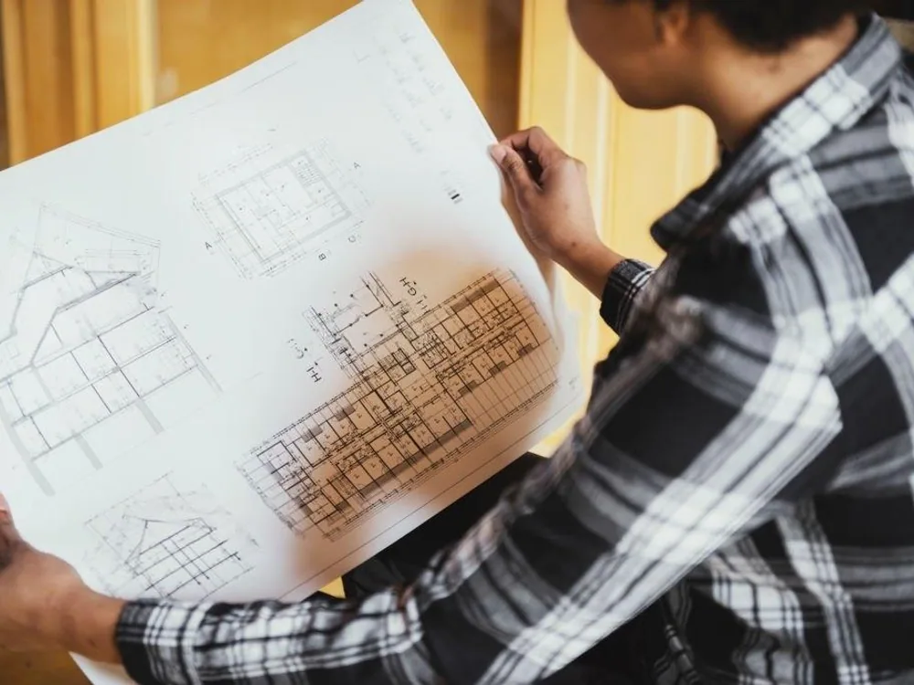 Apro Living designer reviewing modular kitchen plans